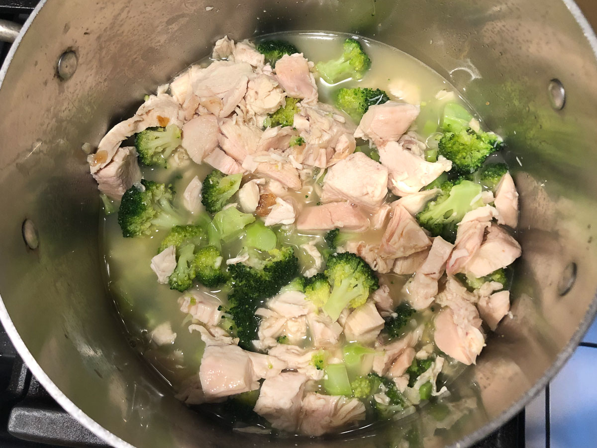 pan with broccoli and chicken and broth