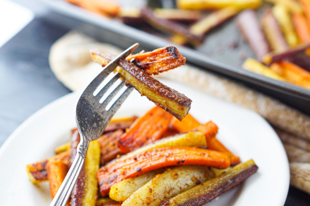 a forkful of curry roasted carrots