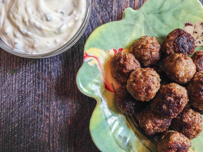 These gyro meatballs & herbed yogurt dip are a fun dish to make for any party. Meatballs with all those great gyro flavors and a lemony herb yogurt sauce to dip them in. #SundaySupper