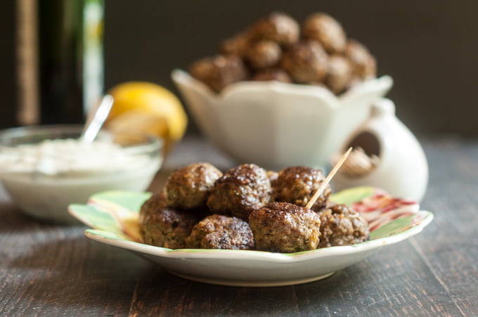 These gyro meatballs & herbed yogurt dip are a fun dish to make for any party. Meatballs with all those great gyro flavors and a lemony herb yogurt sauce to dip them in. #SundaySupper