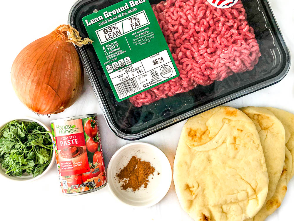 Recipe ingredients - onion, parsley, ground beef, naan bread, spices and tomato paste