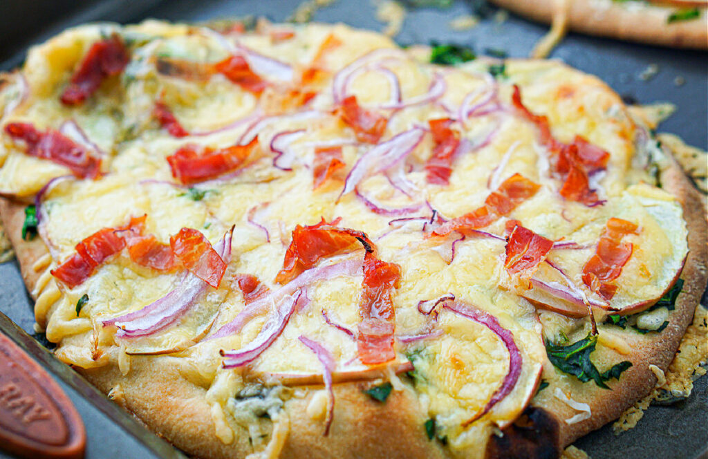 closeup of gouda flatbread pizza