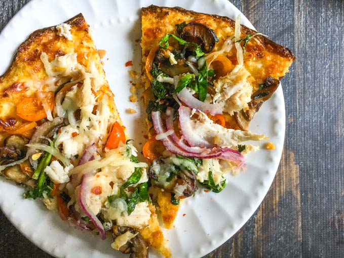 This chicken vegetable pizza is made with a cauliflower crust so it's gluten free as well as delicious!