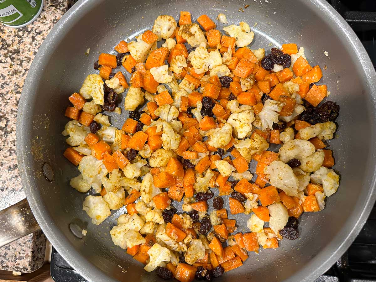 pan with sautéed veggies and raisins