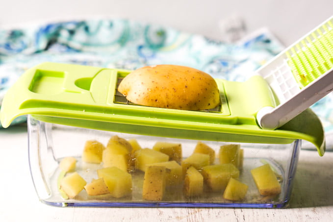 vegetable chopper with a raw potato