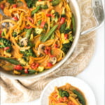 white dish and pan with Thai butternut squash noodles curry and text
