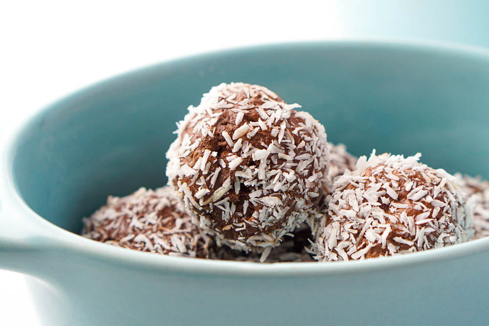 closeup of coconut covered protein energy bites