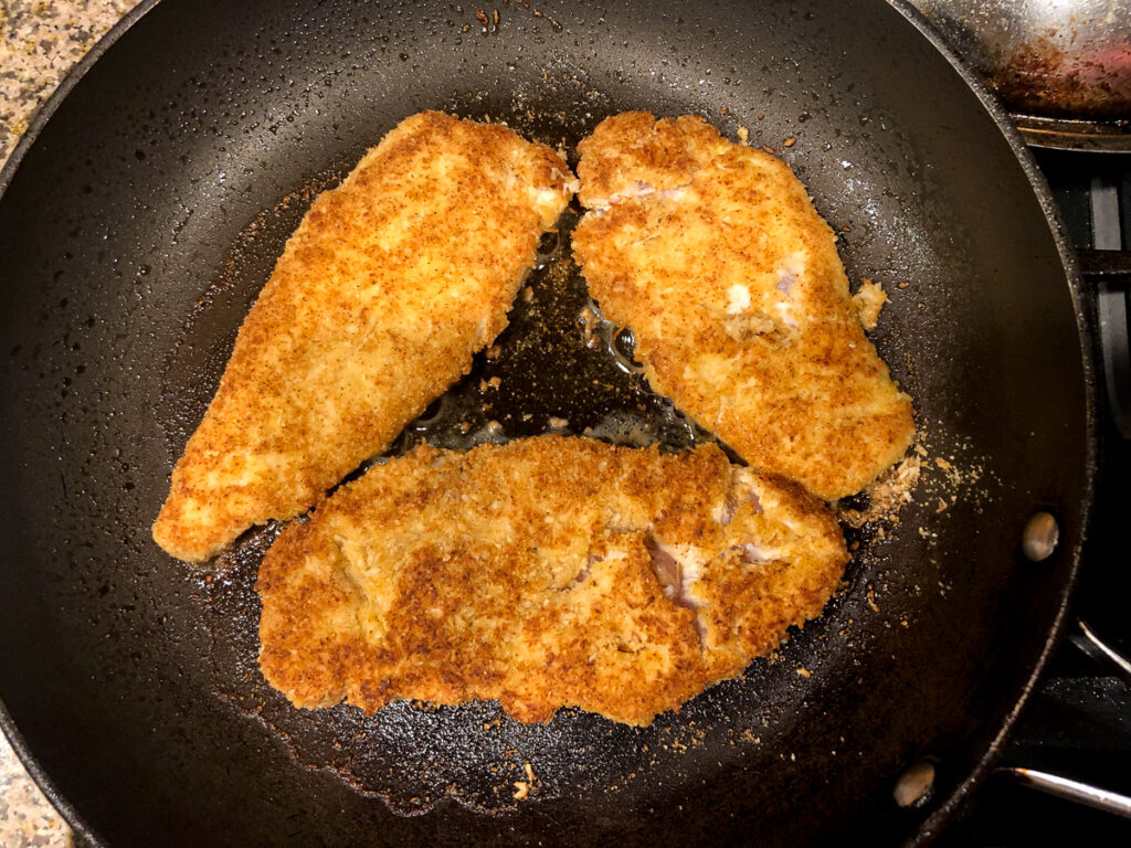 pan with browned breaded chicken