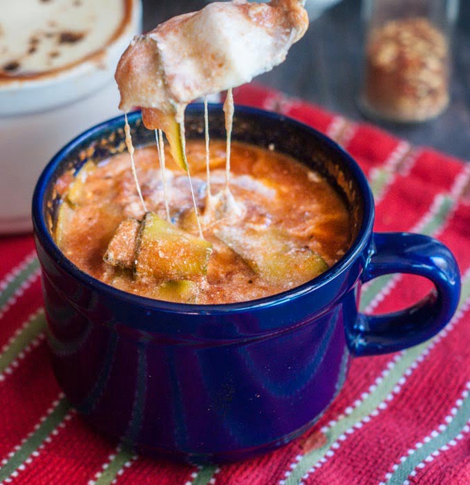 This easy zucchini lasagna soup is like eating a gluten free lasagna in a bowl. Meat sauce, zucchini and lots of cheesy goodness for a heart warming meal.