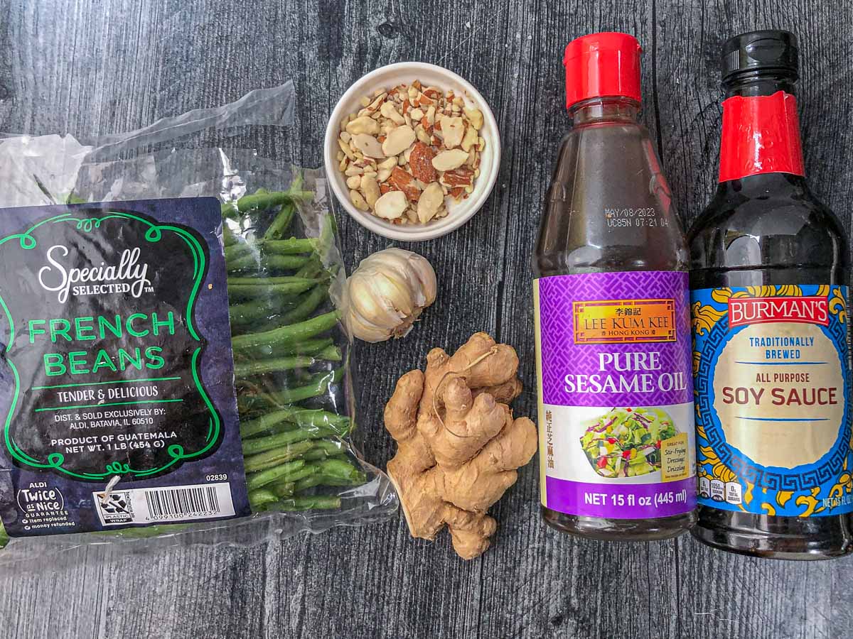 recipe ingredients - sesame oil, soy sauce, garlic, ginger sliced almond green beans