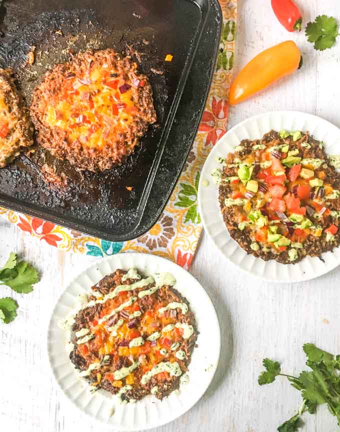 This low carb mini Mexican meatza recipe makes for a delicious lunch or dinner. Think taco meets burger meets pizza. Low carb and super tasty!