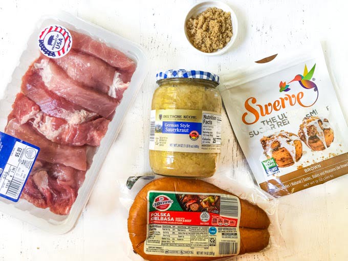 ingredients for pork and sauerkraut: pork country ribs, kielbasa, sauerkraut, Swerve brown sugar and brown sugar