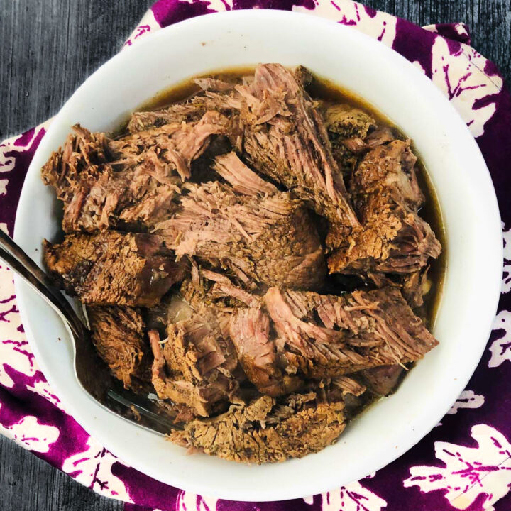 white bowl with instant pot chuck roast with balsamic