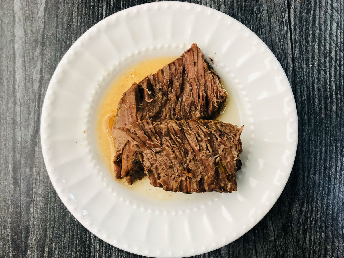 what plate with a few slices of balsamic pot roast