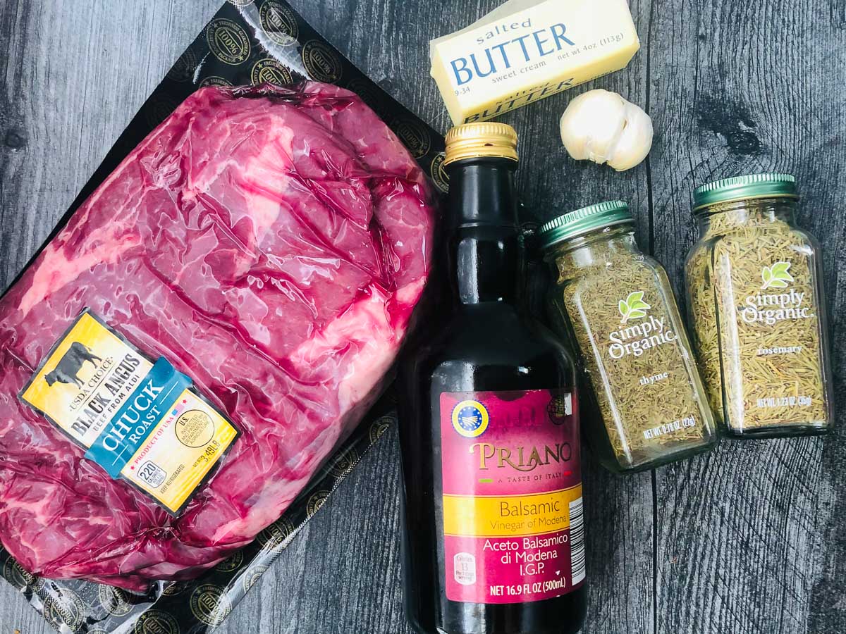 recipe ingredients - chuck roast, balsamic vinegar, garlic, butter, rosemary and thyme