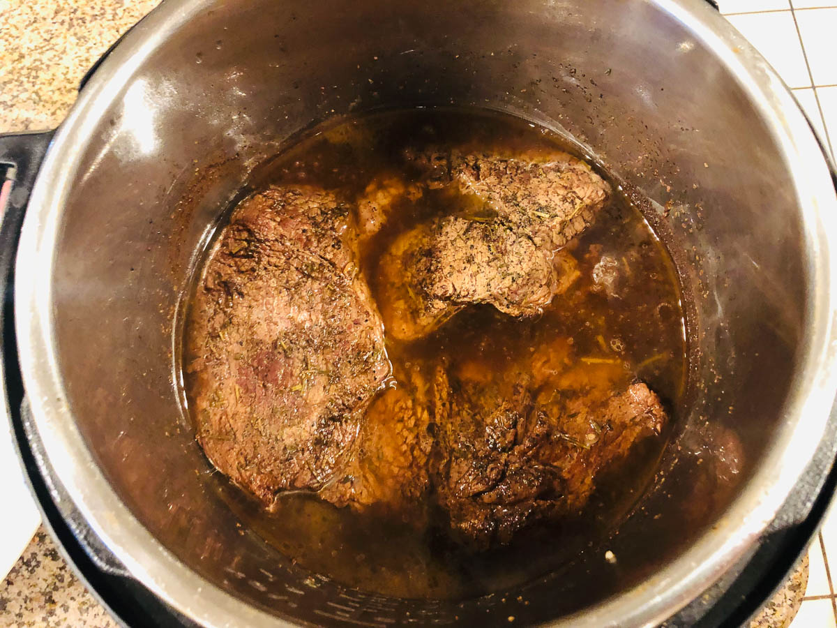 instant pot with cooked chuck roast