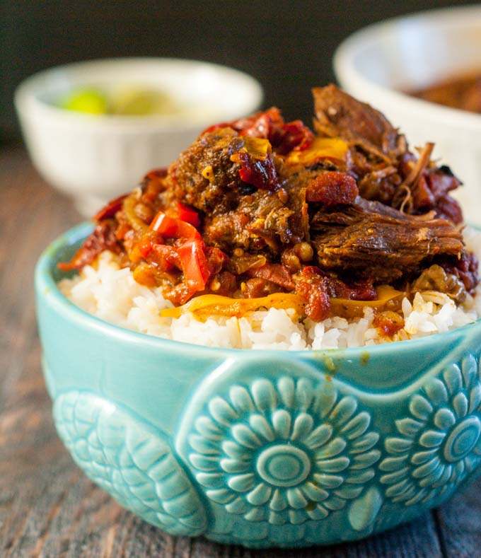 Blue bowl filled with Barbacoa beef and rice.