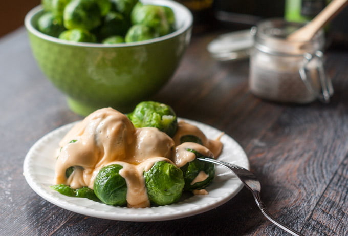 These low carb cheesy Brussels sprouts are a delicious side dish that your whole family will love. Only 4.3g net carbs per serving.