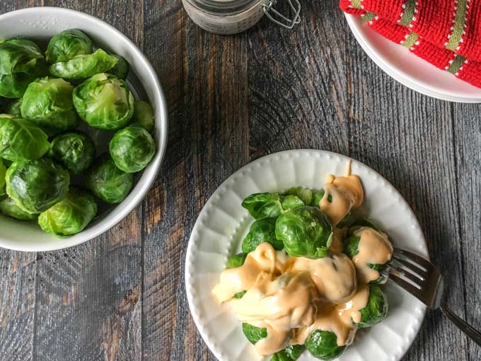 These low carb cheesy Brussels sprouts are a delicious side dish that your whole family will love. Only 4.3g net carbs per serving.