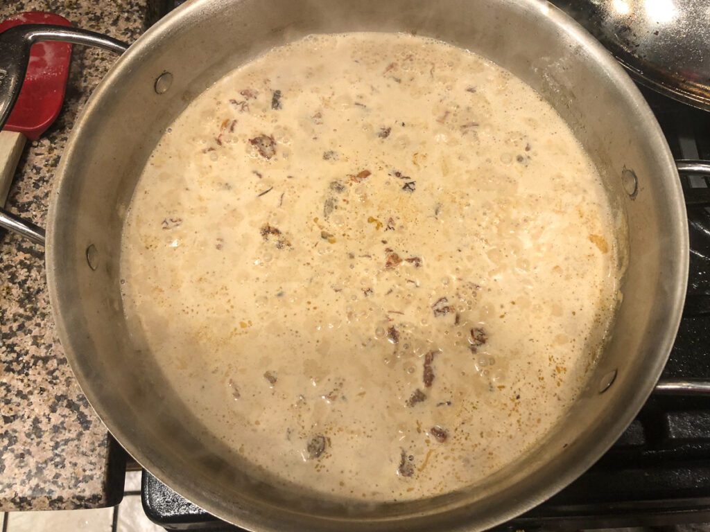pan with creamy asiago sauce