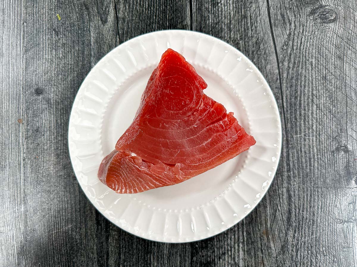 white plate with piece of fresh tuna