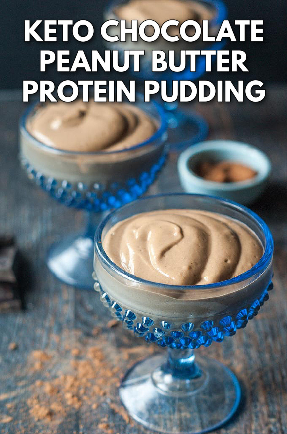 closeup of a blue dessert dish with keto peanut butter chocolate protein pudding with text