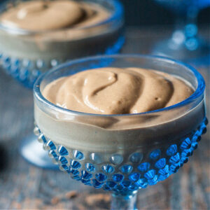 closeup of a blue dessert dish with keto peanut butter chocolate protein pudding