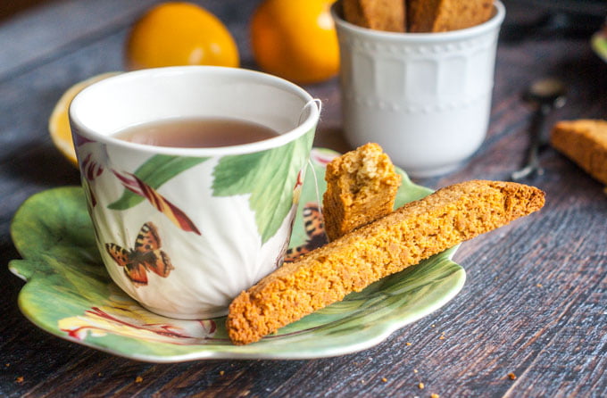 These Paleo Meyer lemon ginger biscotti are so easy to make and are gluten free. Fresh, Meyer lemon and spicy ginger are perfectly balanced with a hint of honey sweetness. 