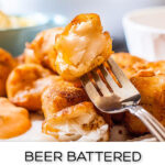 closeup of a plate of beer battered cod nuggets with a fish and text