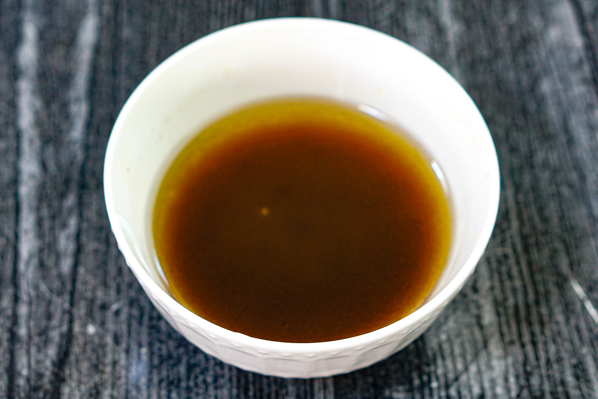 Pickled Beet & Gorgonzola Spinach Salad - bright, beautiful, delicious and nutritious! Small white bowl with salad dressing.