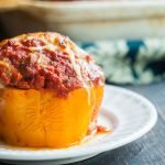 These cheesy meatball stuffed peppers are perfect for the meat lover. Mozzarella stuffed inside a huge meatball that's stuffed in a sweet bell pepper. Perfection!