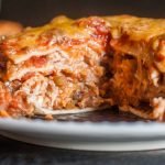 This chicken burrito lasagna is quick and easy in the Instant Pot and only takes 5 ingredients. It's like a big chicken burrito the whole family can share!