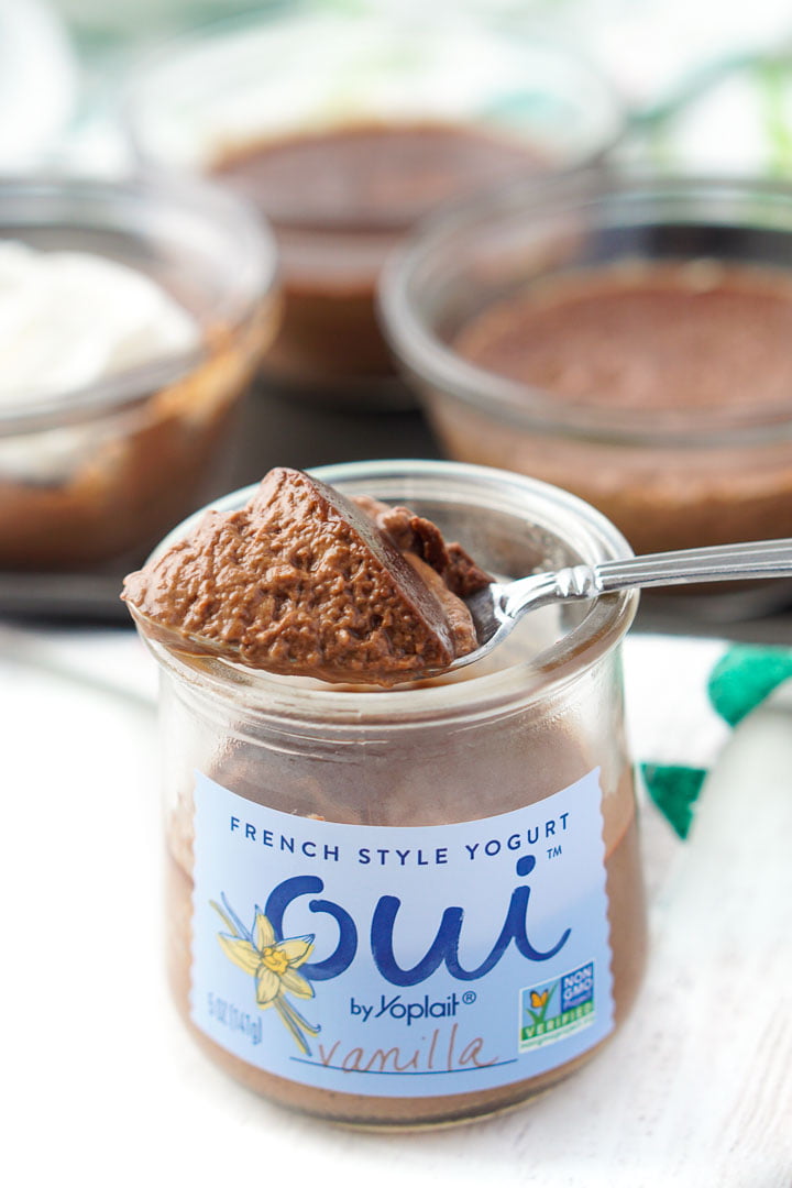 Oui yogurt jar filled with sugar free chocolate mousse and spoon on top