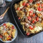 These easy sheet pan Italian style nachos are a fun twist on the usual. Packed with all the ingredients of a good sausage pizza or pasta but in sheet pan form so all can share.