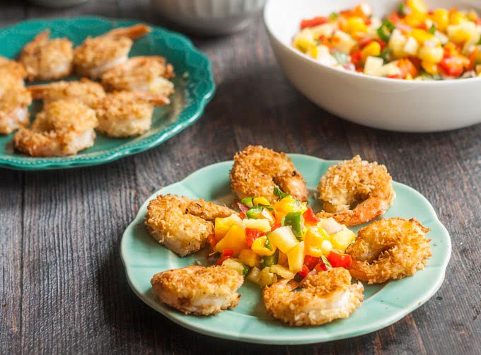 This Paleo coconut shrimp & pineapple mango salsa can be ready in less than 30 minutes. The bright, light fruit salsa, tastes delicious with the crunchy coconut shrimp!