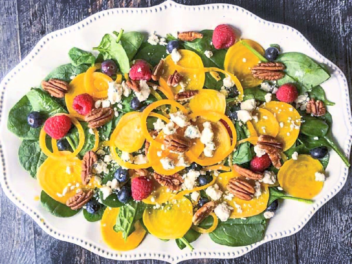 Pickled Beet & Gorgonzola Spinach Salad - bright, beautiful, delicious and nutritious! A large platter with the finished spinach salad.