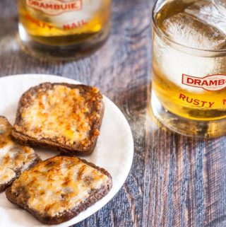 It's a retro party with Parmesan toast & rusty nail cocktails. Crunchy savory toasts are perfect with the sweet, aromatic rusty nail.