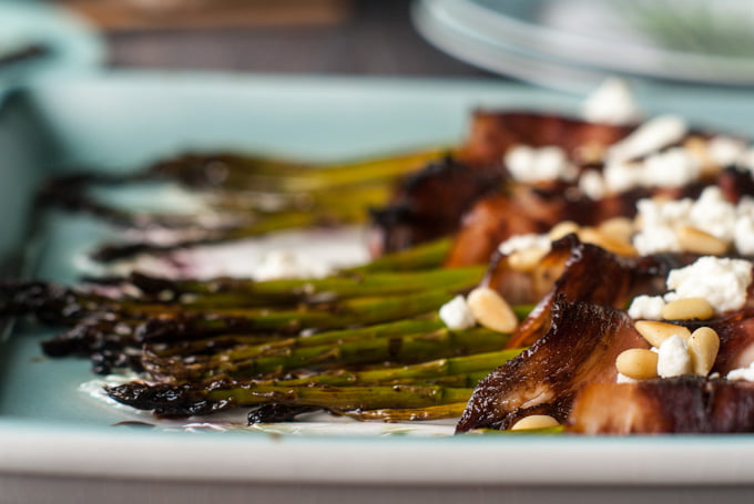 This wrapped asparagus with goat cheese & balsamic glaze is an easy and elegant side dish with only 6 ingredients. Salty ham, creamy cheese, fresh asparagus topped with sweet glaze and crunchy pine nuts. Perfection!