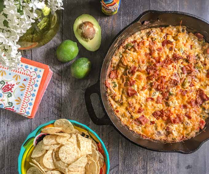 This alambre skillet cheese dip is has got it all: steak, peppers, onions, cheese and yes even bacon! A fun appetizer to celebrate Cinco de Mayo.