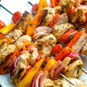 Closeup of a platter with keto chicken fajita skewers.