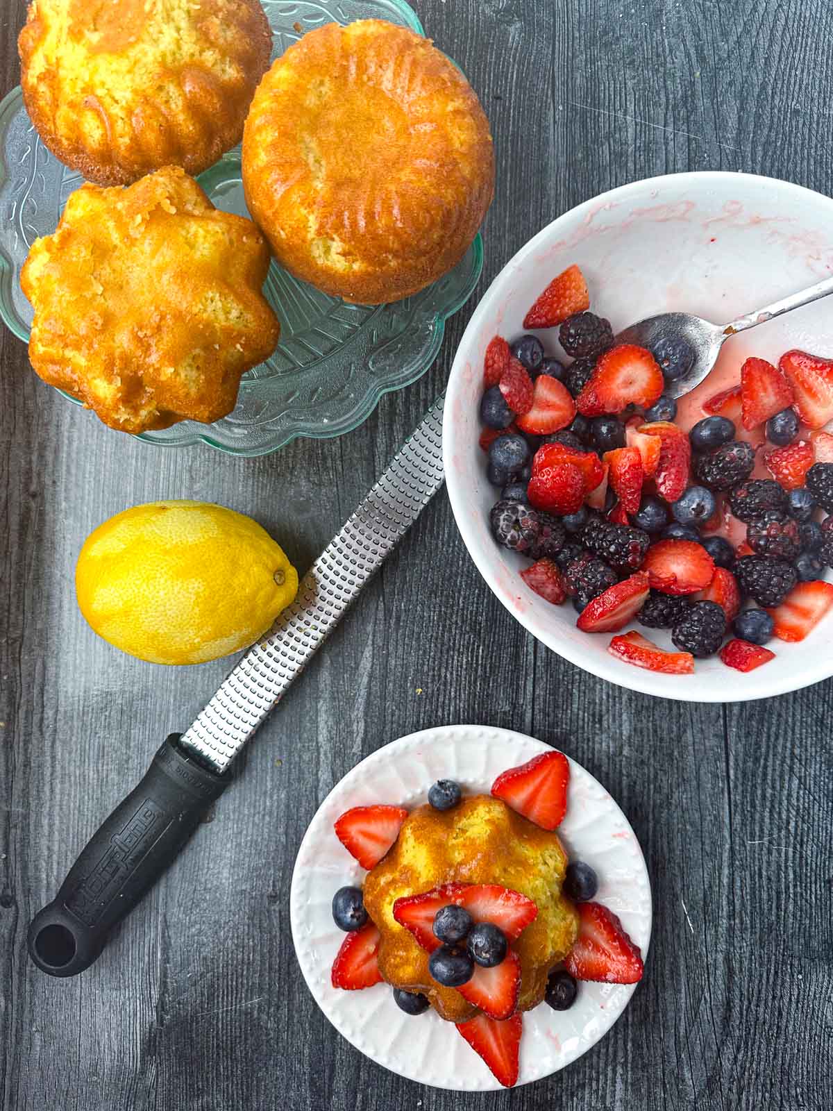 aerial view of lemon pound cakes and a bowl of berries