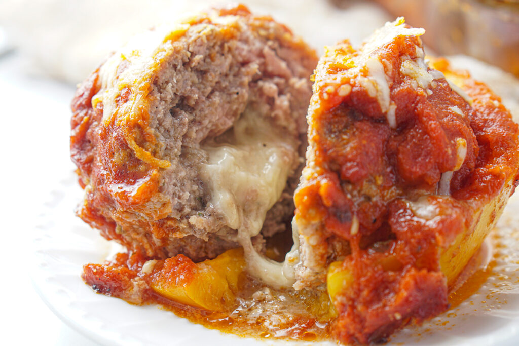 cut meatball pepper with cheese oozing out