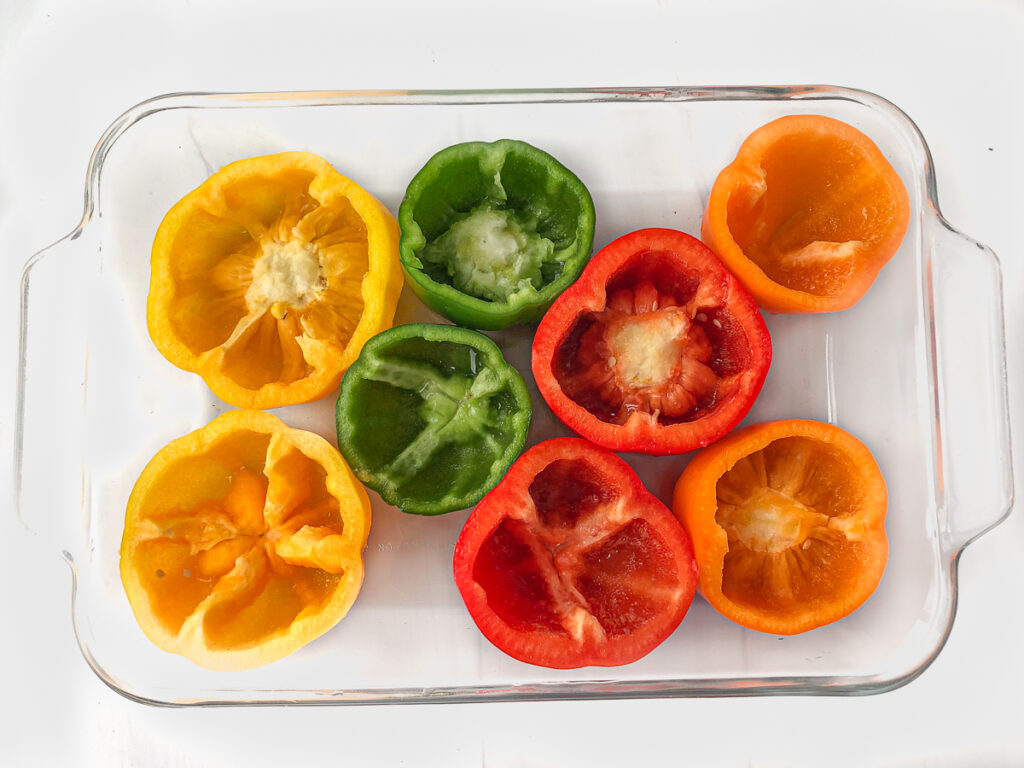 colorful raw bell peppers cut in half and cleaned
