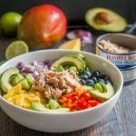 This Paleo mango salsa bowl with tuna is a colorful bowl of healthy goodness! Makes for the perfect quick and easy lunch or even dinner.
