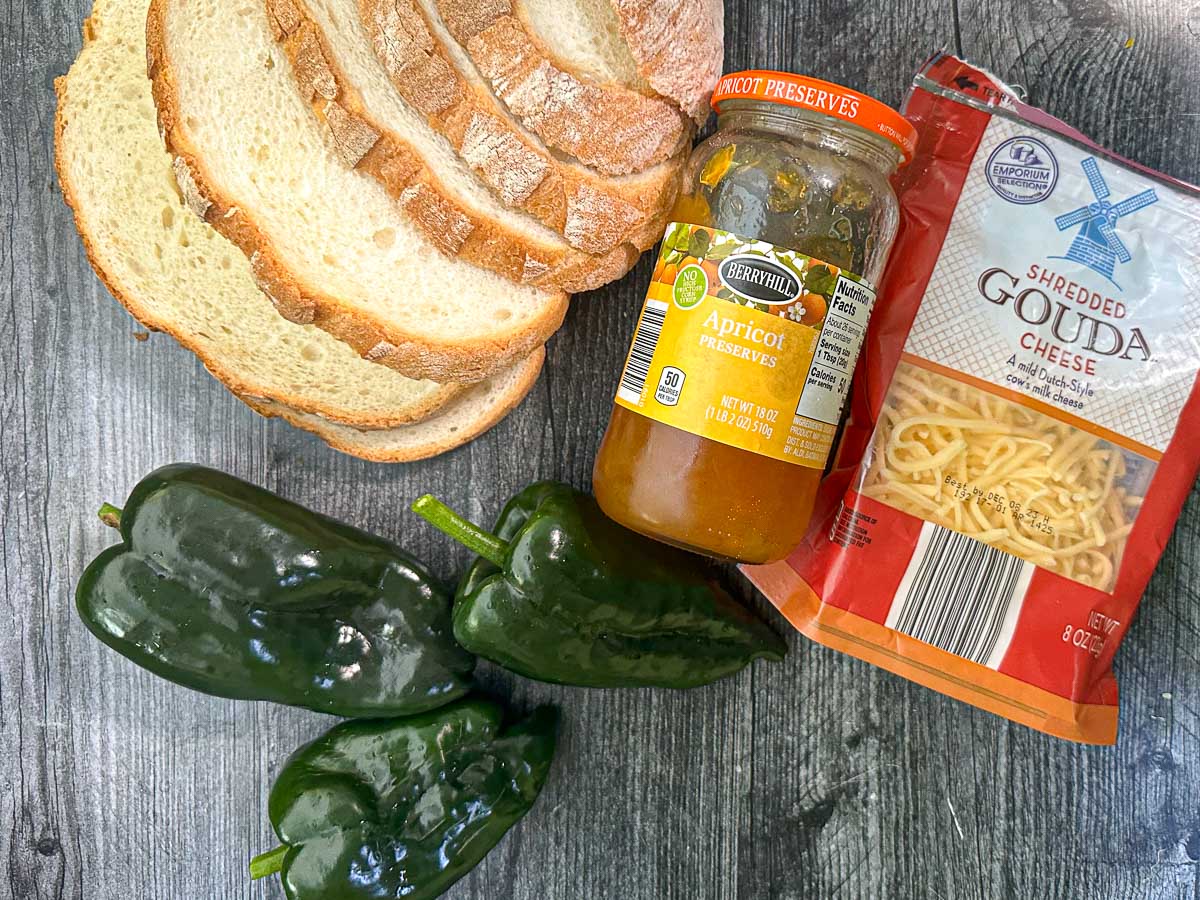 recipe ingredients - crusty bread, apricot jam, poblano peppers, gouda cheese