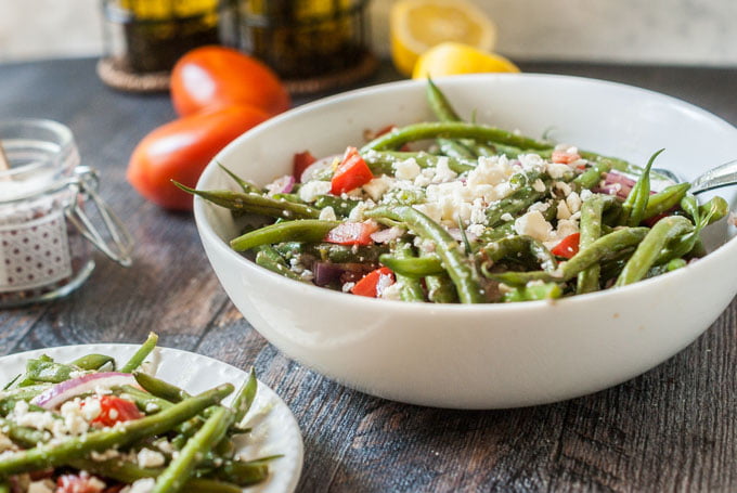 This Greek green bean salad is the perfect summer salad. Using vegetables from your garden or farmer's market, you can make this delicious vegetarian salad in 15 minutes. 