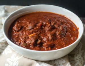 This chunky beef chili without beans is super easy in the Instant Pot but can also be made in the slow cooker. A great dish for those on a Paleo diet or for those who can't tolerate beans.