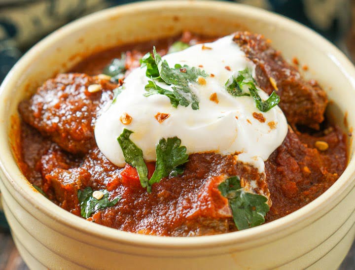 closeup of yellow bowl with chunky bean less beef chili 