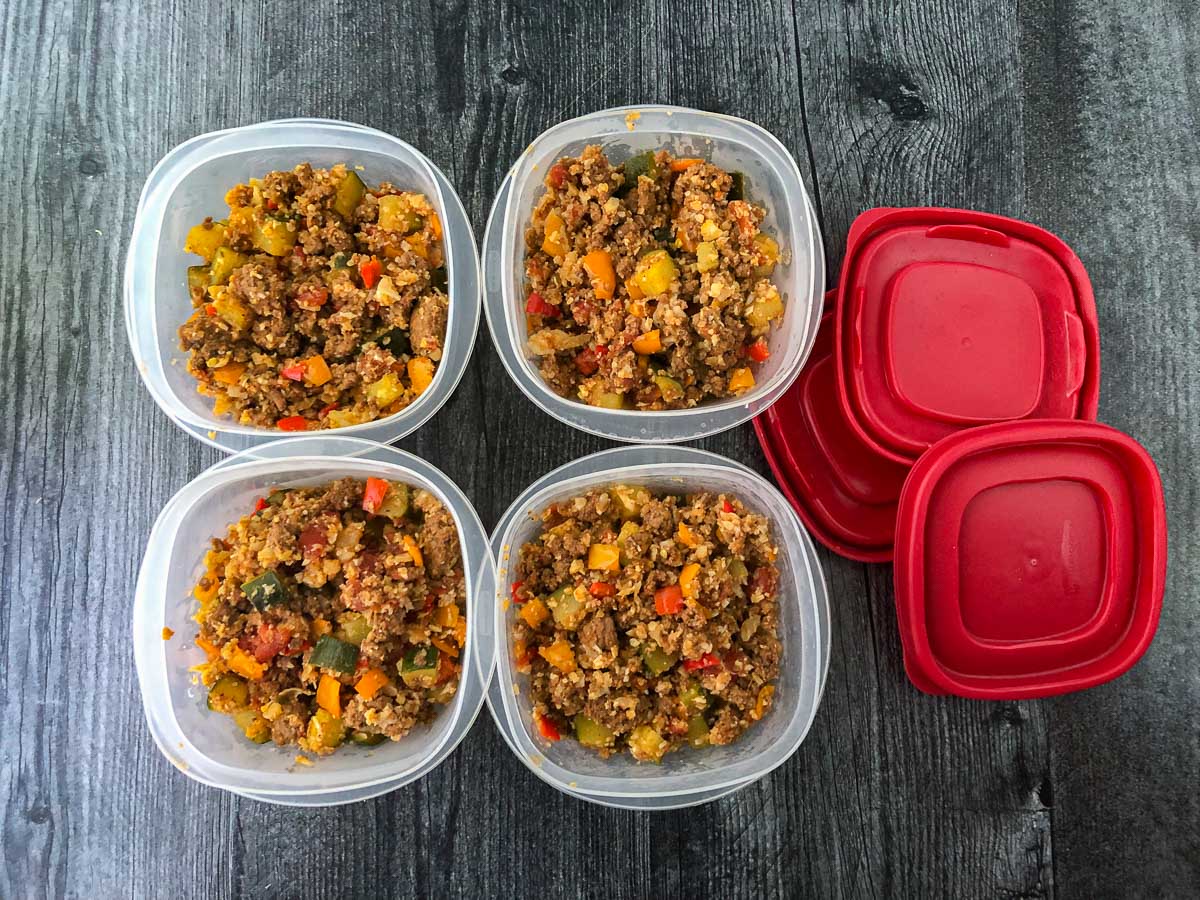 4 freezer containers filled with low carb mexican rice and the lids