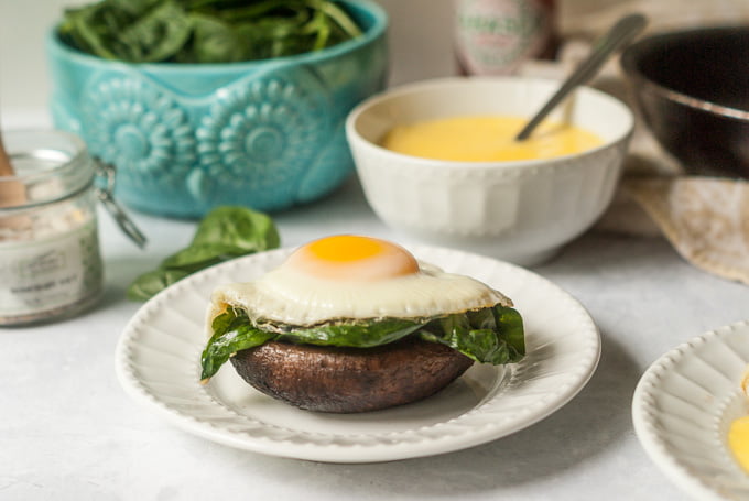These portobello eggs with hollandaise sauce are a delicious low carb breakfast or lunch. Meaty portobellos, garlicky spinach and a sunny side up egg, topped with a rich and delicious hollandaise sauce. 